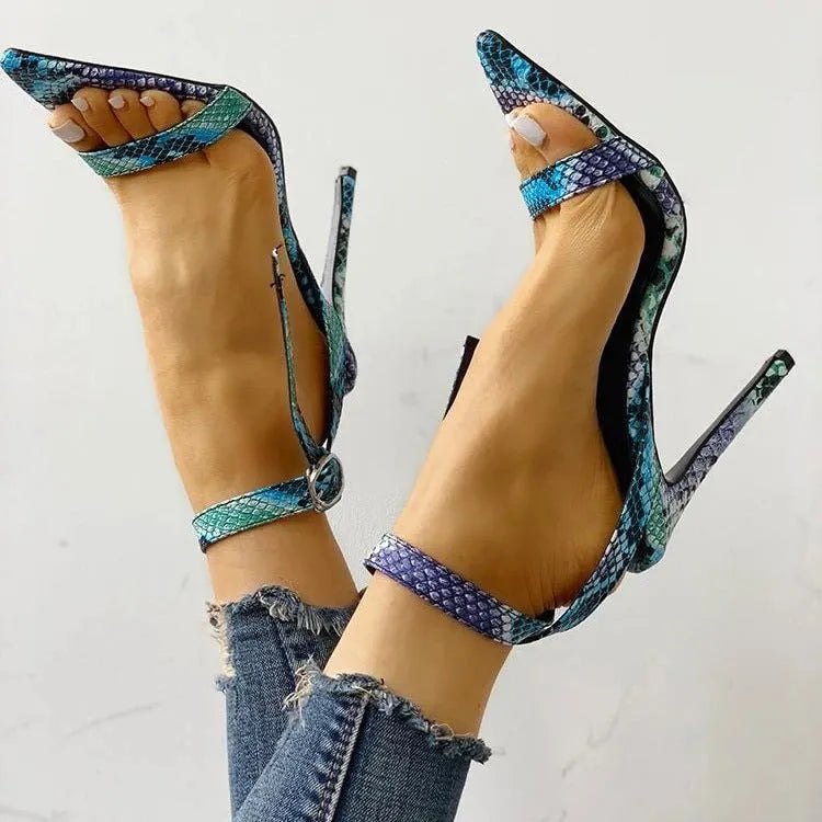 Blue hollow-out high heels with a buckle, pointed toe, and artificial PU upper.