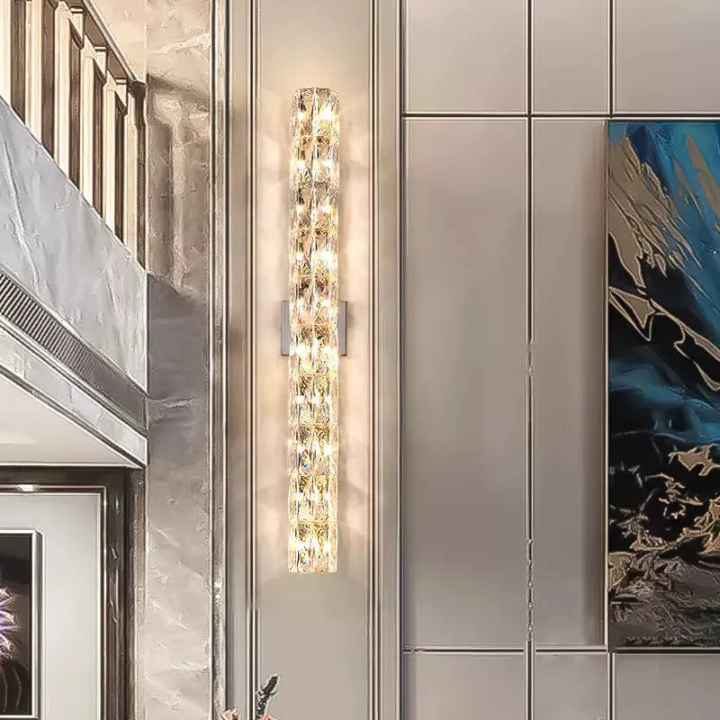 Crystal shade wall lamp with stainless steel body in chrome or gold finish, shown in multiple sizes.