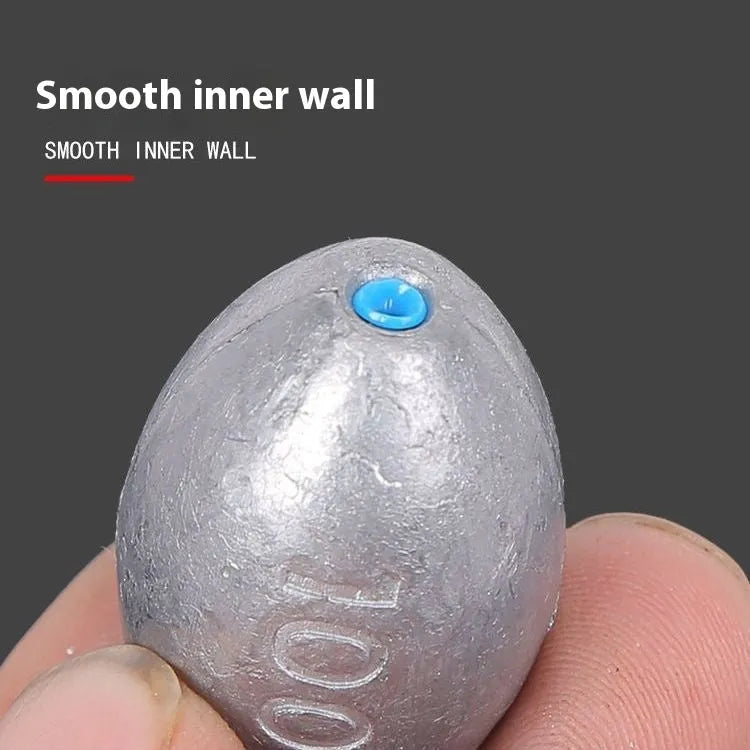 Rugby-shaped olive lead fishing sinker with plastic core in multiple weight sizes