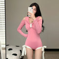 Women's long sleeve one-piece swimsuit in pink or black colour