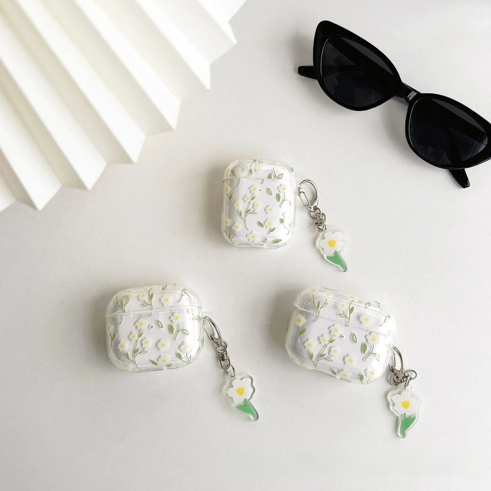 White floral pattern transparent TPU protective case for Apple AirPods showing soft shell design