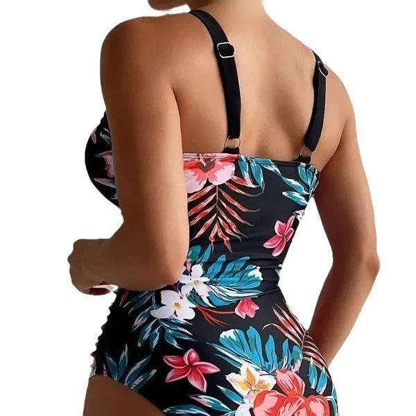 Women's floral pattern backless one-piece swimsuit on a hanger