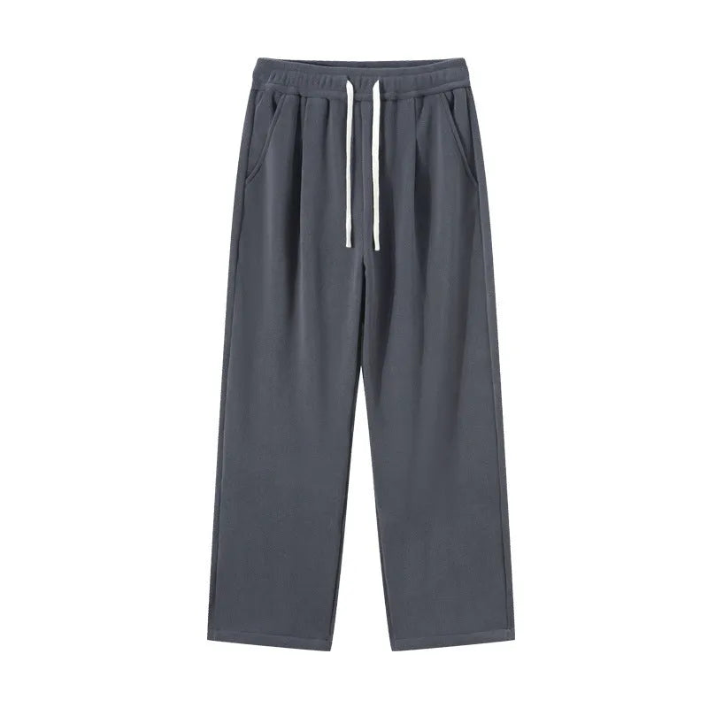 Men's apricot double-sided polar fleece casual trousers with a drawstring waistband, shown laid flat.