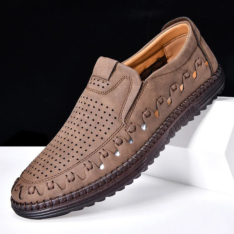 Men's brown casual slip-on leather shoes with round toe and flat sole on a white background.