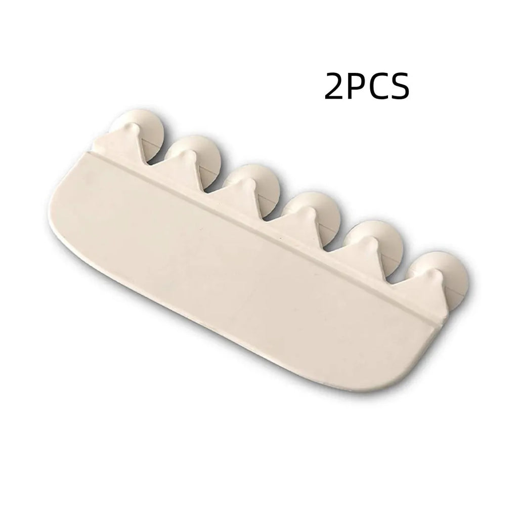 White PVC toilet urine splash guard board for boys potty training on a toilet seat.
