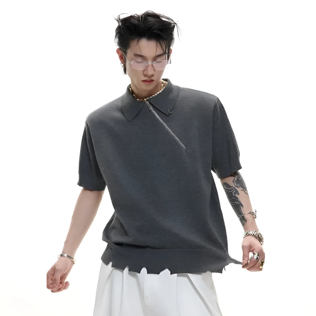 Man modelling a slim-fit black knitted polo shirt with an angled diagonal zipper and a lapel collar.