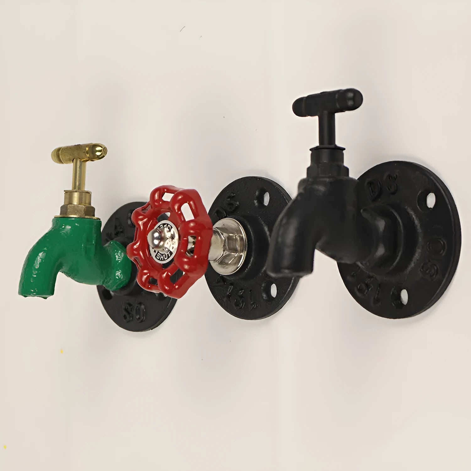 Metal water pipe style towel hook mounted on a wall in black, green, or red.