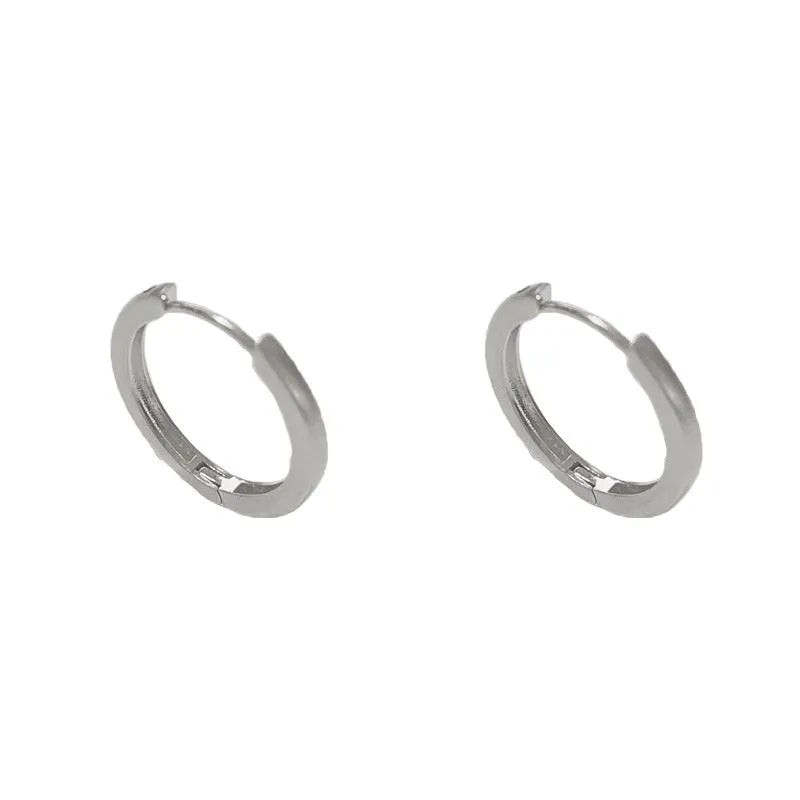 Women's geometric circle ear clip with round element in gold or silver finish, real gold plated copper minimalist jewellery