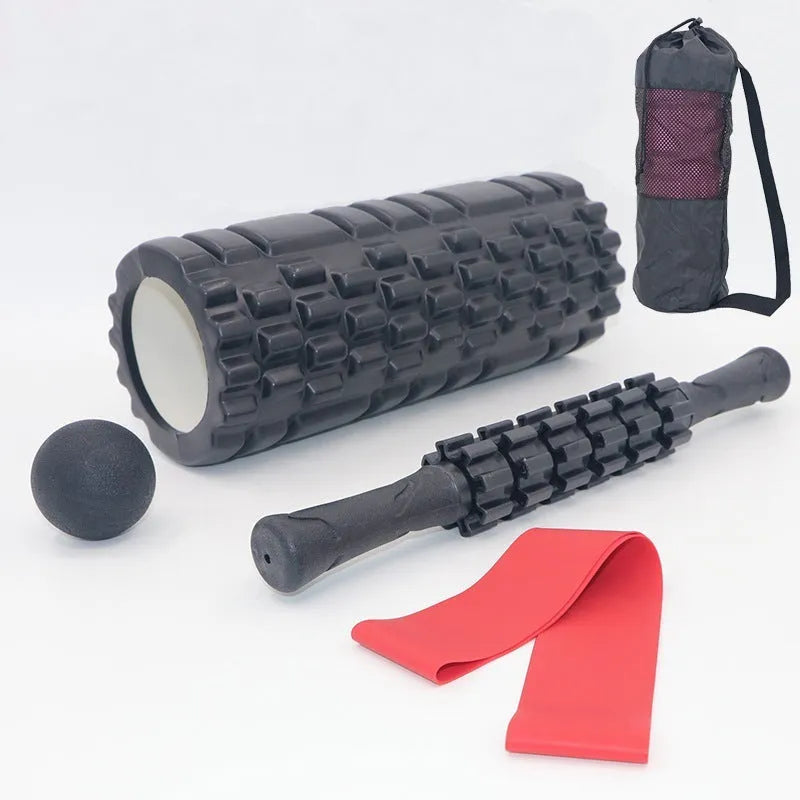 Black foam fitness roller with six-piece gear design, 33cm length, for massage and recovery.