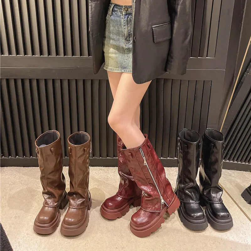 Women's black platform Martin boots with a square heel and high cylinder sock length on a rubber sole.