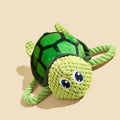 Turtle-shaped plush dog chew toy with knotted texture and squeaker inside