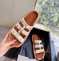 Women's brown Roman style sandal slippers made from glossy patent sheepskin leather
