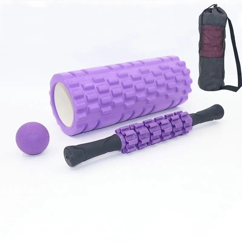 Black foam fitness roller with six-piece gear design, 33cm length, for massage and recovery.