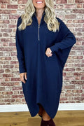 Dark green loose knitted women's dress with full front zipper and raglan sleeves on a hanger.