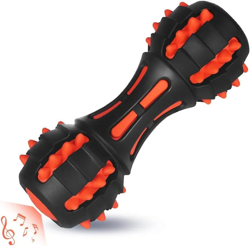 Red dumbbell-shaped rubber dog chew toy with textured surface for dental cleaning
