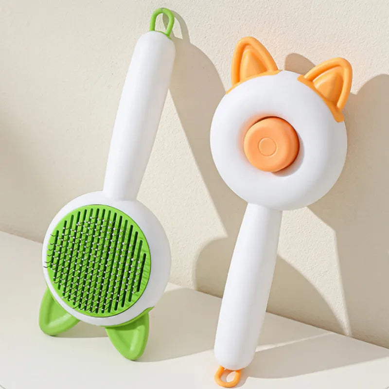 Self-cleaning cat grooming brush with stainless steel teeth in greenish white or orange white colour