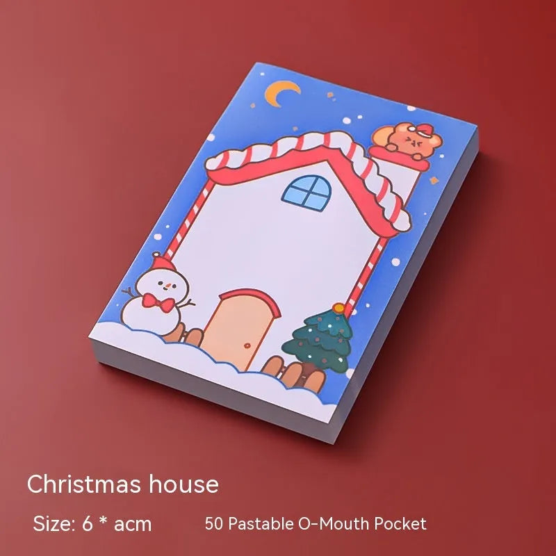 Christmas sticky notes book with cartoon designs of Santa, snowman, elf, gift, house, sled, crystal ball, and bear