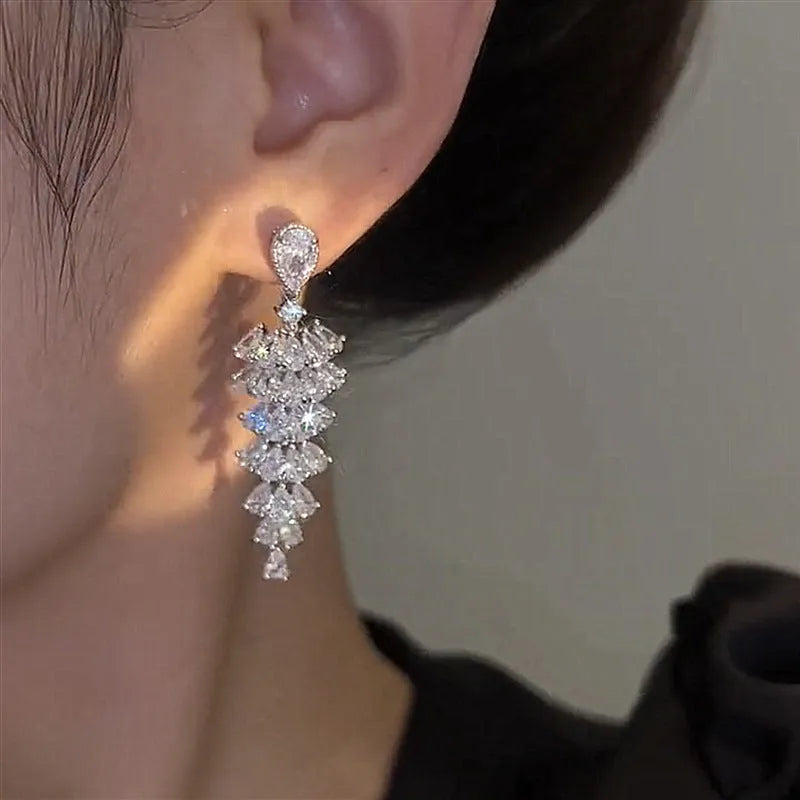 Silver pagoda coloured drop earrings with a sparkling zircon Christmas tree design on copper studs.