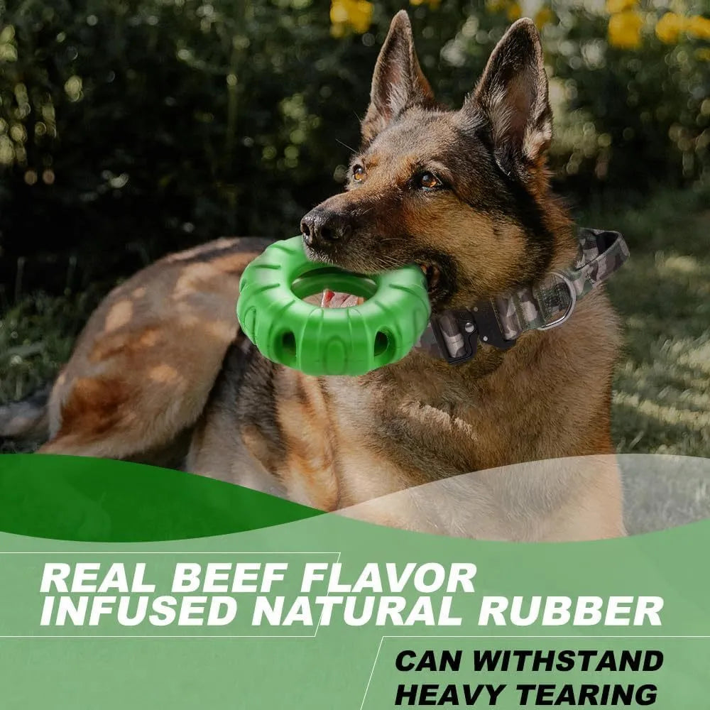 Beef-flavoured red rubber tyre dog chew toy with oval openings for treat dispensing