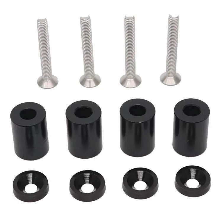 Aluminium engine cover spacers in black, blue, and red colours with installation hardware