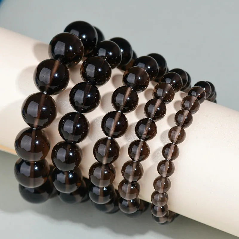 Hand-woven obsidian bracelet with round crystal beads in multiple colour options and sizes