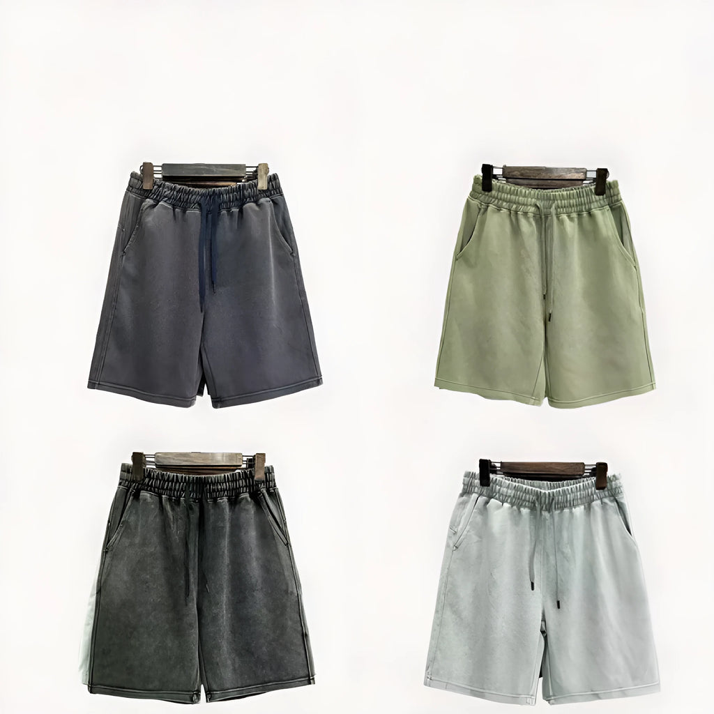 Men's distressed cotton shorts in solid colours with loose straight leg cut