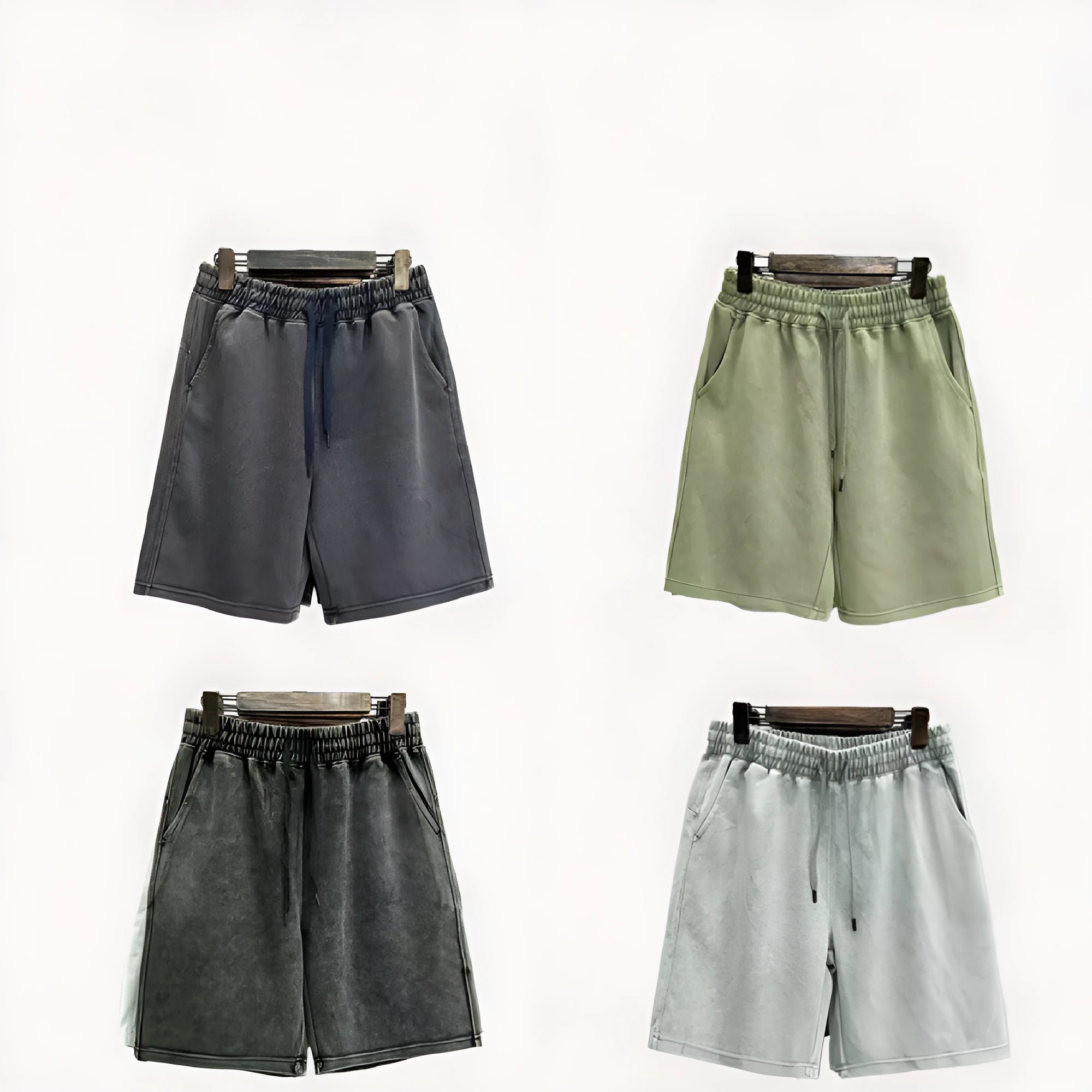 Men's distressed cotton shorts in solid colours with loose straight leg cut