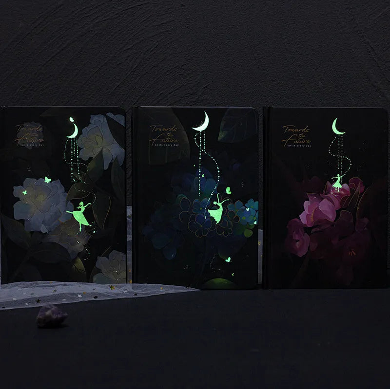 A5 notebook with luminous cover open to show colour illustrated pages, in Purple colour option.