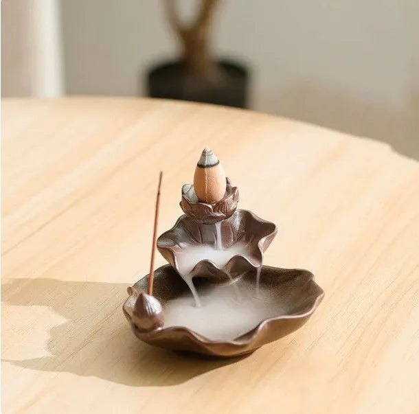 Square ceramic reverse flow incense burner with purple clay construction and lotus plum blossom decoration