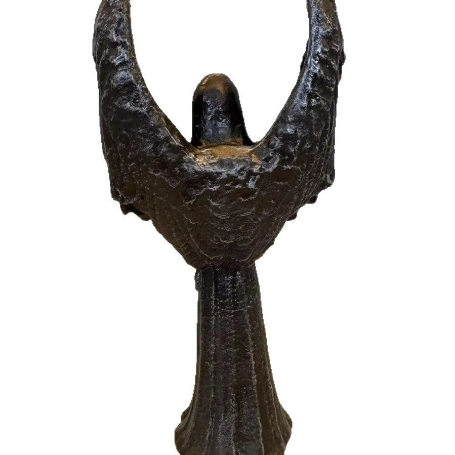 Dark coloured resin angel statue ornament with dimensions 6.5 cm by 5 cm by 17 cm.