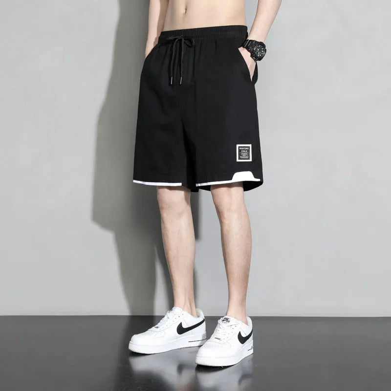 Cotton shorts for teenage boys in black, khaki, and white, showing mid-waist fit and shorts length.