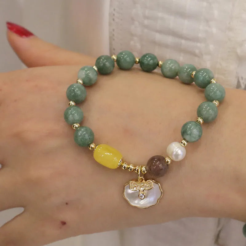 Natural green jade stretch bracelet with polished beads on wrist