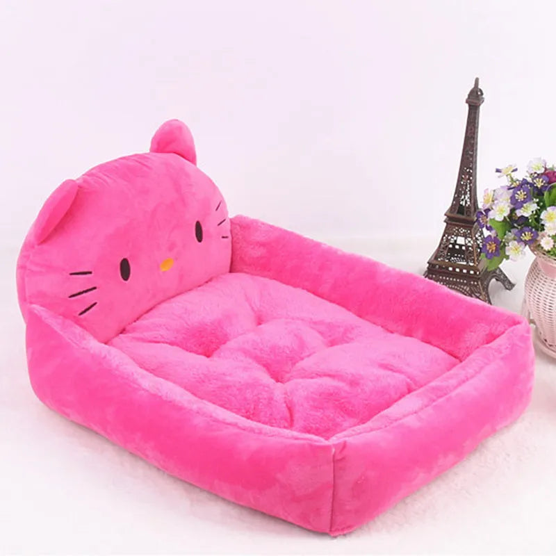 Blue cartoon-style pet bed sofa for a small dog, showing soft plush interior.
