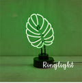 White minimalist bamboo-shaped desk lamp with green glow, showing USB cable and two size options.