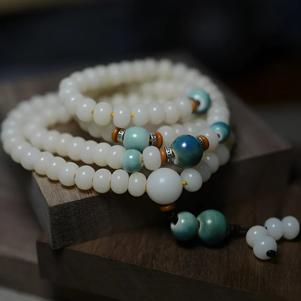 White Jade Bodhi Root bracelet with 108 flat round beads, shown in two size options.