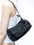 Black nylon shoulder bag with double pockets and side line detail, showing compact dimensions
