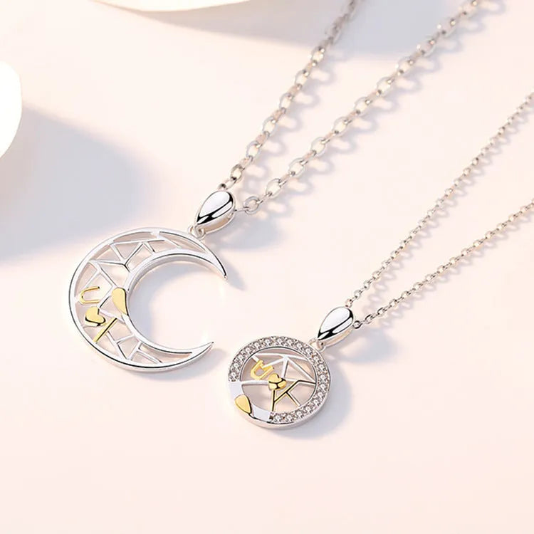 Sun Moon Tooth couple necklace set showing male and female copper pendants on cross chains