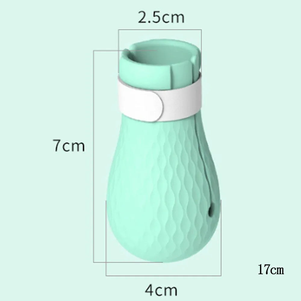 Four green silicone foot covers for protecting hands from cat scratches during pet care.