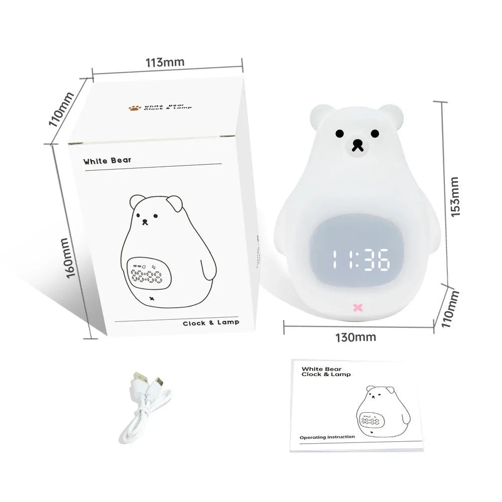 White cartoon bear silicone night light with remote control on a bedside table.