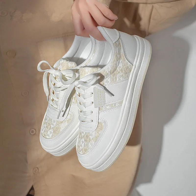 Beige platform sports board shoes with plaid pattern, rubber soles and lace-up front closure