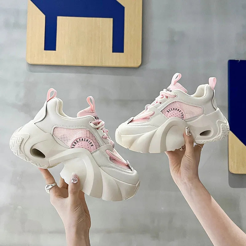 Women's pink casual sneakers with cross strap design and thick mid-heel sole