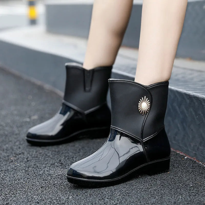 Women's low tube PVC rain boot in beige colour with non-slip sole.