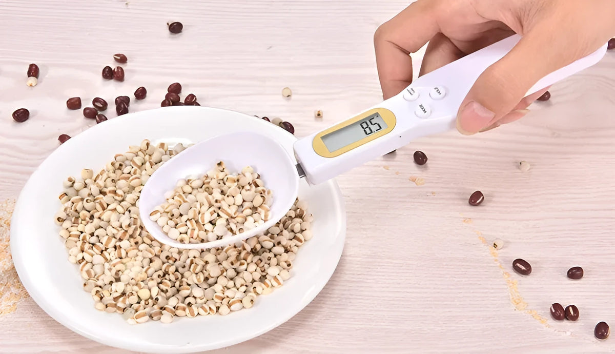 Black electronic measuring spoon scale showing digital display and spoon bowl for kitchen weighing