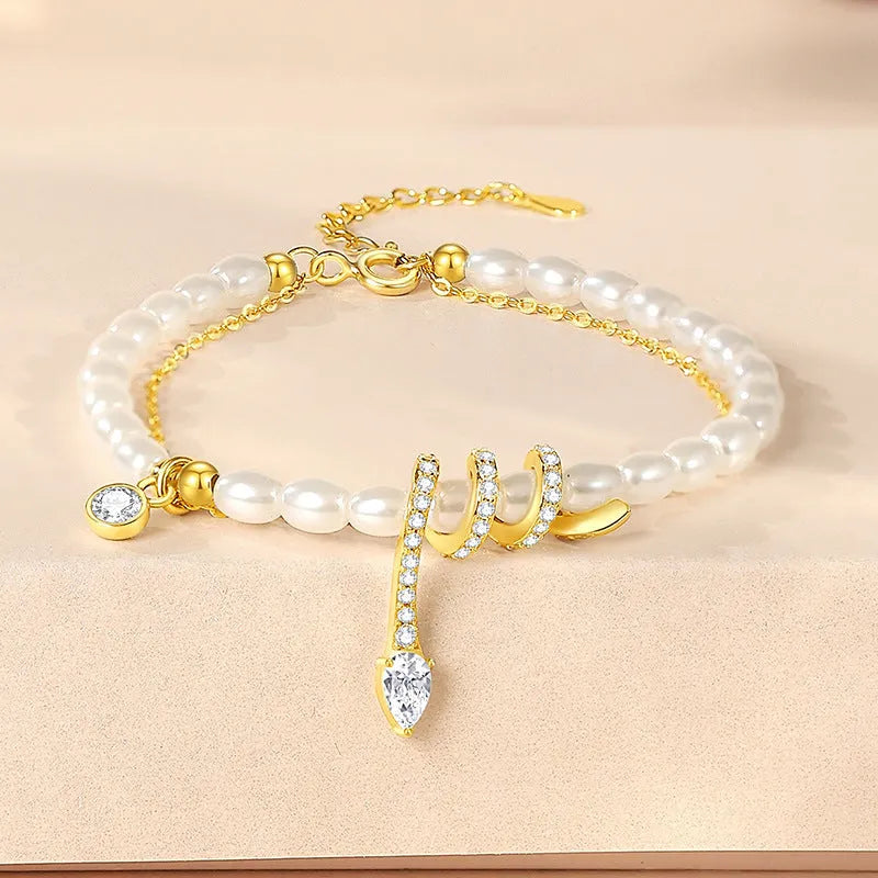 Pearl snake bracelet in 925 silver with geometric beaded design and electroplated gold finish