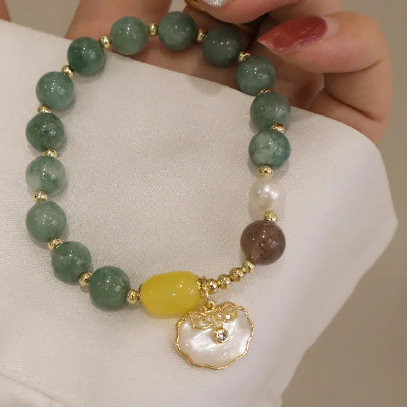 Natural green jade stretch bracelet with polished beads on wrist