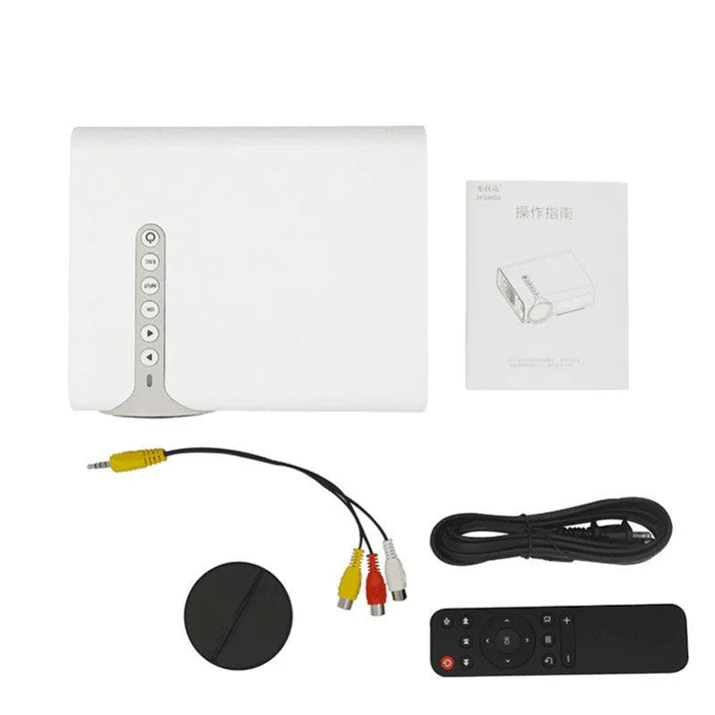 YG530 black and white mini portable LED projector with wireless mobile phone connectivity on a table.