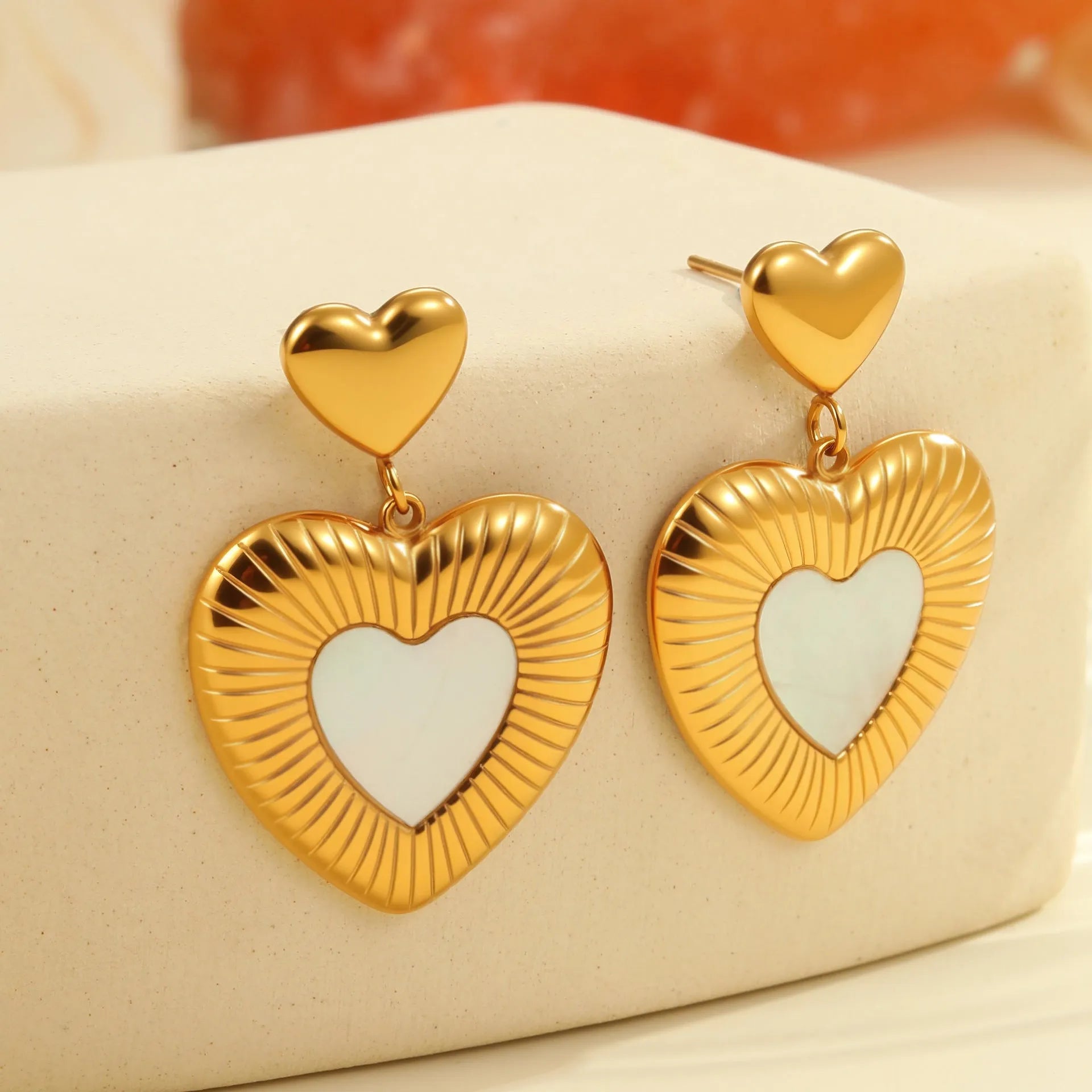 Gold electroplated heart-shaped stainless steel earrings for women with love-themed design