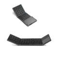 Black tri-fold Bluetooth keyboard shown unfolded with ultra-thin profile beside silver folded version