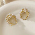Gold copper flower basket earrings with small rice-shaped beads and pearl inlay detail
