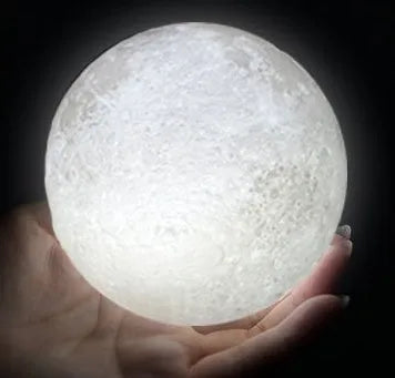 3D printed moon light lamp on wooden stand with detailed lunar surface, showing touch ring at base.